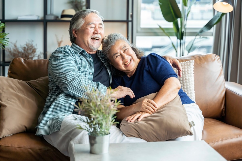 Senior couple relaxing in their home