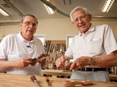 Senior men building woodwork crafts